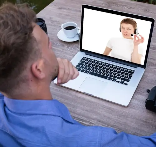 A student using laptop for online lesson with the tutor