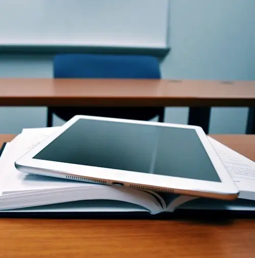 A tablet computer and a book