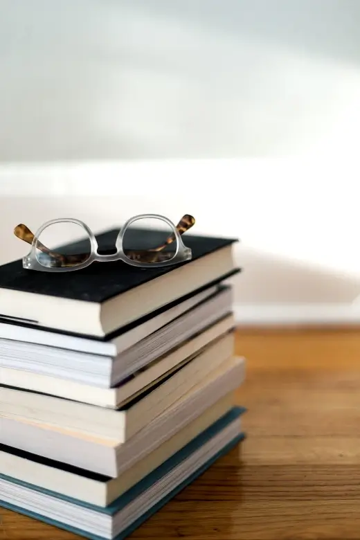 Textbooks and reading glasses